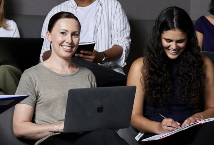 Commerce students in a modern lecture hall